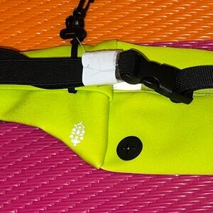 FP Movement slim fold runner sling bag honeydew yellow neon hip bag